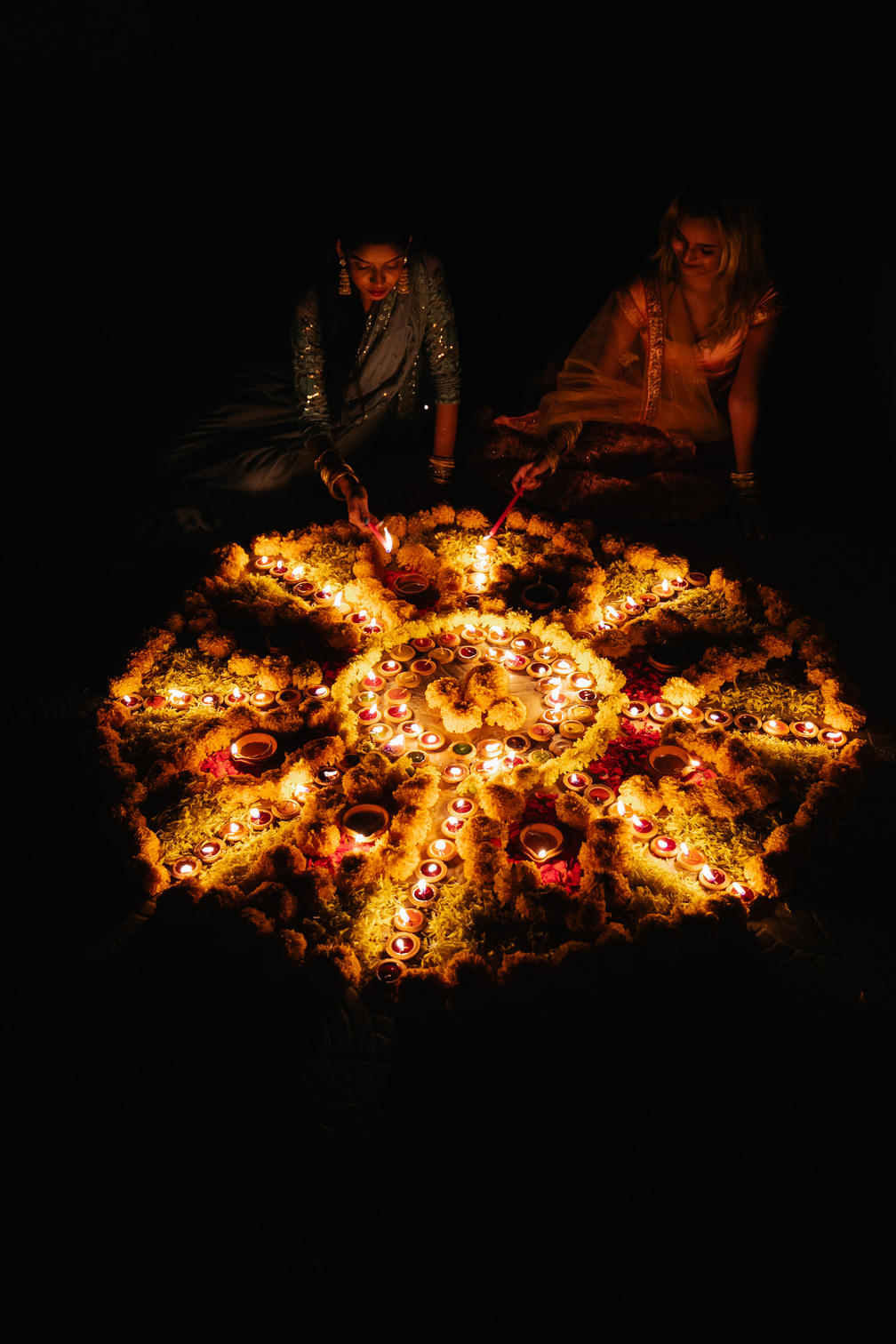 Women Sitting by Circle of Candles